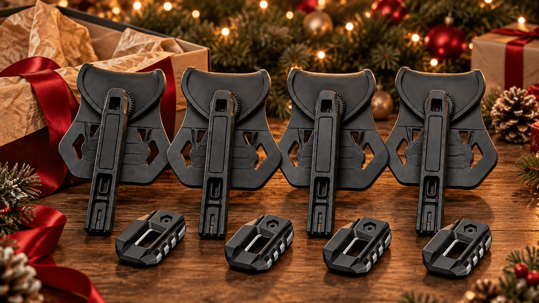 Four TACFENDER Universal Holster PRO holsters and rail-lock adapters with a gift box and holiday decorations